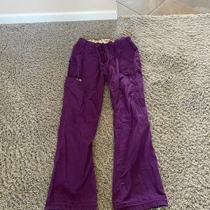 Purple Kio scrub bottoms with elastic ties to make them joggers